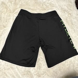 Hylete Men’s shorts above the knee size Medium black with lime green letters
